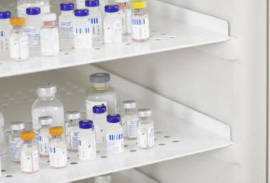 Vaccine vials stored in a clinical refrigerator