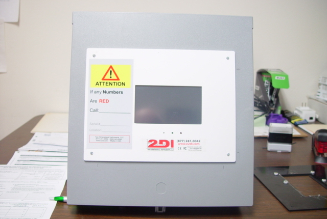 TV2 monitor mounted on plastic box